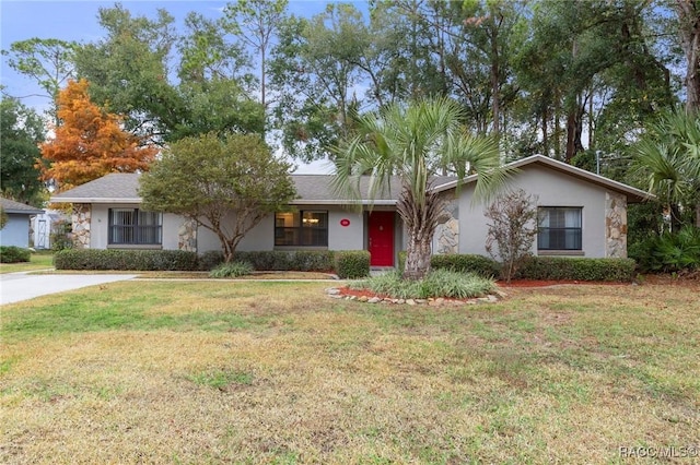 ranch-style house with a front lawn