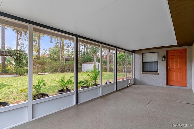 unfurnished sunroom featuring a healthy amount of sunlight