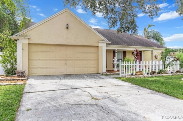 single story home with a garage and a front yard