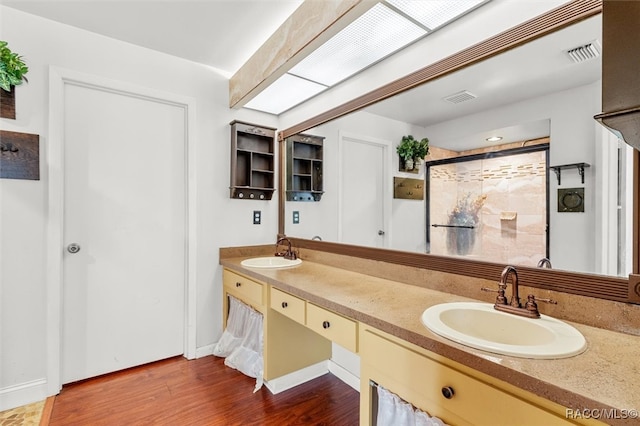 bathroom featuring hardwood / wood-style floors and vanity