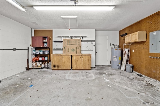 garage with electric water heater and electric panel