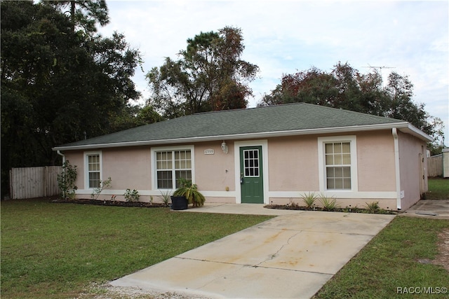 single story home featuring a front yard