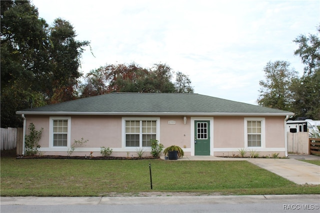 ranch-style house with a front yard