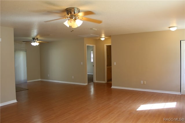 spare room featuring hardwood / wood-style floors, a textured ceiling, and ceiling fan