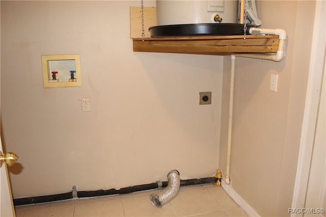 clothes washing area with washer hookup, electric dryer hookup, light tile patterned floors, and water heater