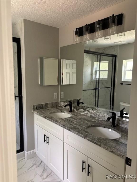 3289 W Camilo Dr, Dunnellon, FL 34433 - bathroom with a marble finish shower, marble look tile flooring, double vanity, and a textured ceiling