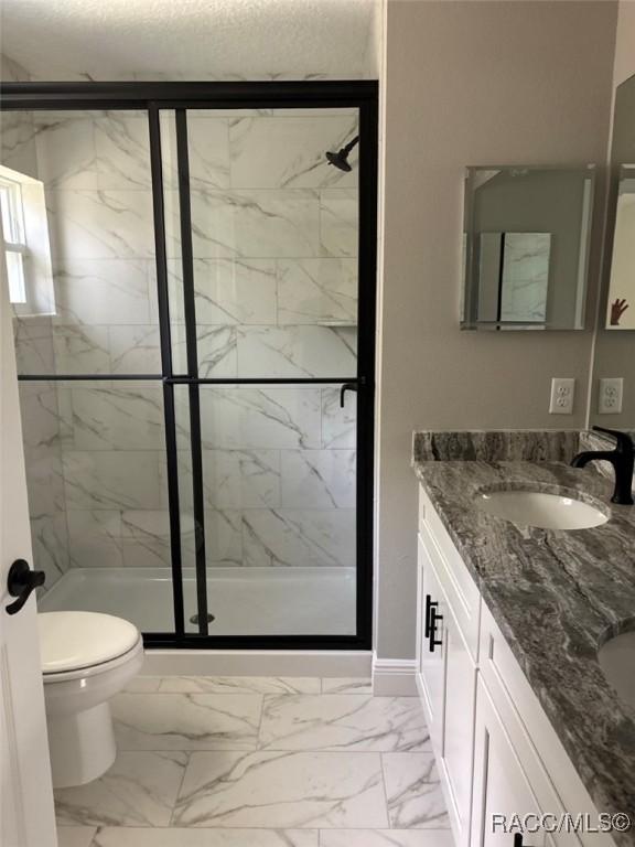 3289 W Camilo Dr, Dunnellon, FL 34433 - full bathroom featuring marble finish flooring, a marble finish shower, and double vanity