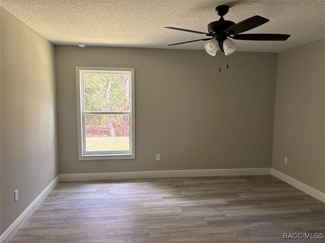 3289 W Camilo Dr, Dunnellon, FL 34433 - unfurnished room featuring wood finished floors, a textured ceiling, and ceiling fan