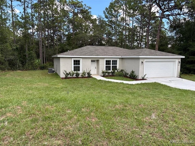 3289 W Camilo Dr, Dunnellon, FL 34433 - single story home with an attached garage, driveway, stucco siding, and a front lawn