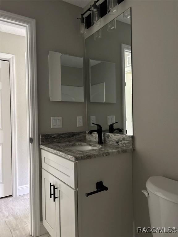3289 W Camilo Dr, Dunnellon, FL 34433 - bathroom with vanity and toilet