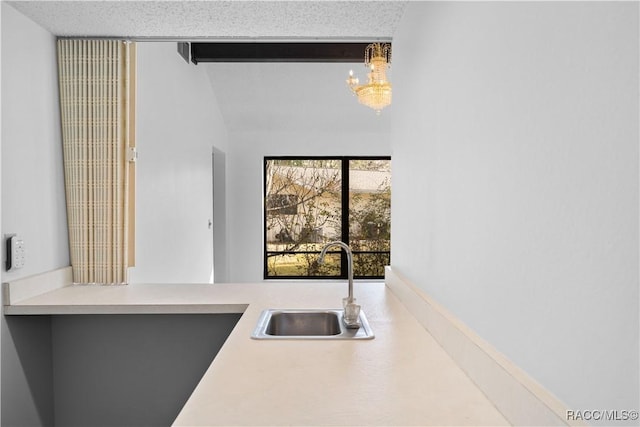 kitchen with an inviting chandelier and sink