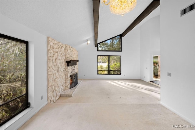 unfurnished living room featuring a fireplace, high vaulted ceiling, a notable chandelier, light colored carpet, and beam ceiling