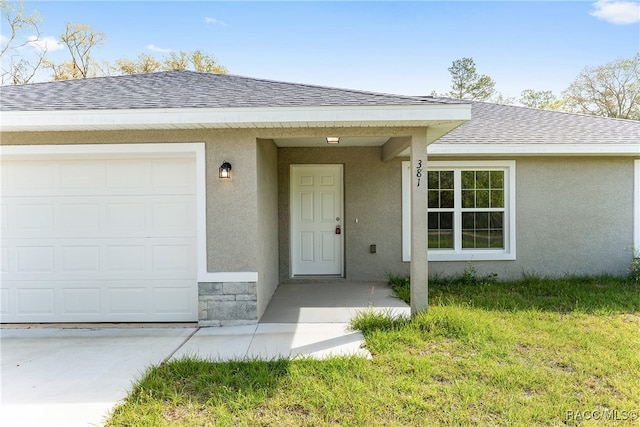 entrance to property featuring a garage