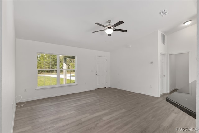 unfurnished living room with ceiling fan and light wood-type flooring