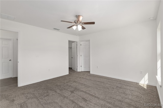 carpeted empty room featuring ceiling fan