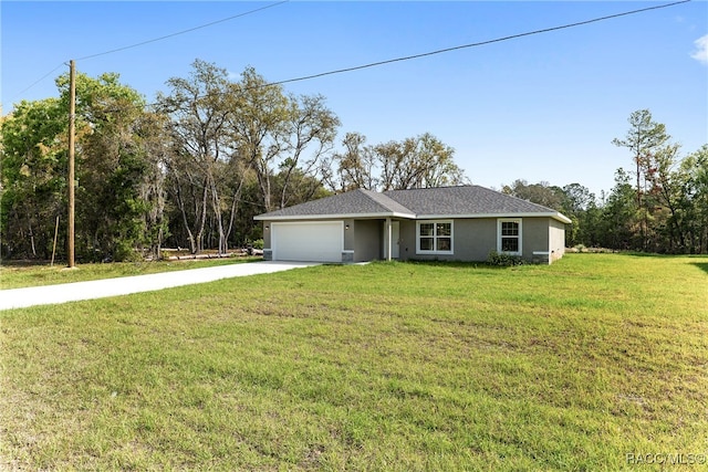 view of front of home featuring a garage and a front yard