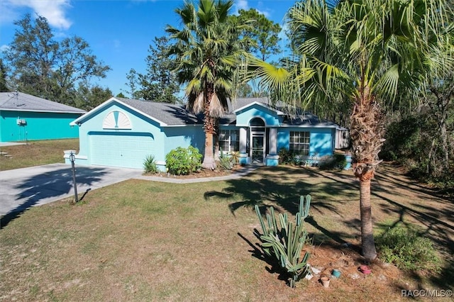 single story home with a garage and a front lawn