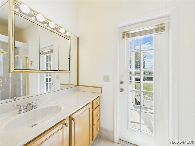 full bathroom featuring vanity, tile patterned flooring, and a shower stall