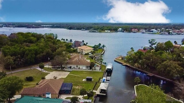 bird's eye view featuring a water view and a residential view