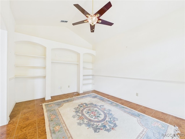 unfurnished bedroom with ceiling fan, visible vents, and lofted ceiling