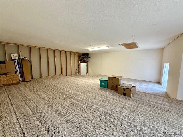 basement with carpet floors and a textured ceiling