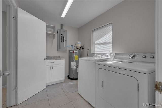 laundry area featuring light tile patterned floors, electric panel, cabinet space, water heater, and washer and dryer