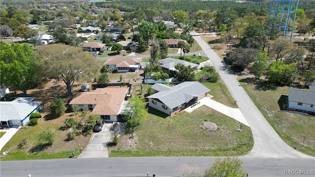 birds eye view of property with a residential view