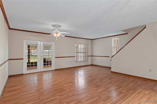 unfurnished living room with french doors, ornamental molding, a textured ceiling, ceiling fan, and light hardwood / wood-style floors