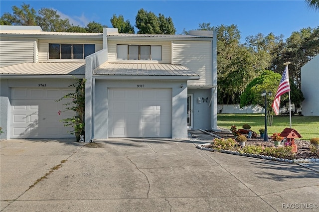 view of front of house with a front lawn and a garage