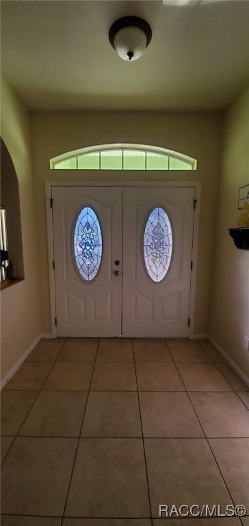 7689 N Galt Pt, Citrus Springs, FL 34434 - entryway with light tile patterned floors and healthy amount of natural light