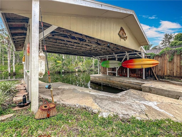 857 N Palm Springs Ter, Crystal River, FL 34429 - view of patio featuring a boat dock, fence, and a water view