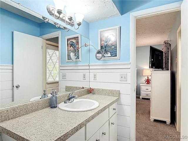 857 N Palm Springs Ter, Crystal River, FL 34429 - bathroom featuring a textured ceiling and vanity