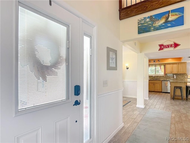 857 N Palm Springs Ter, Crystal River, FL 34429 - entrance foyer featuring a wainscoted wall and light wood-style floors