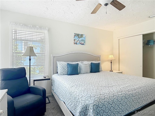 857 N Palm Springs Ter, Crystal River, FL 34429 - carpeted bedroom with a textured ceiling, a closet, and ceiling fan