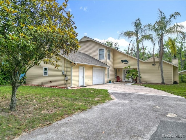 857 N Palm Springs Ter, Crystal River, FL 34429 - traditional-style home with driveway, a shingled roof, a front lawn, and a garage