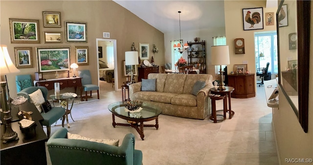 living room featuring high vaulted ceiling, light tile patterned floors, and a notable chandelier