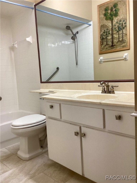 full bathroom featuring vanity, toilet, and tiled shower / bath combo