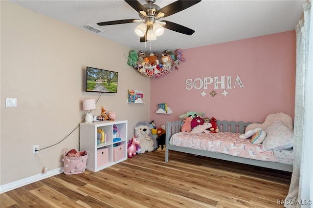 bedroom featuring wood-type flooring and ceiling fan