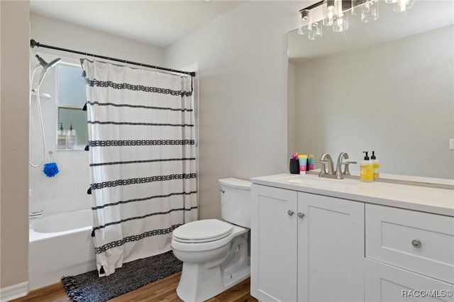 full bathroom featuring hardwood / wood-style flooring, vanity, toilet, and shower / bath combo