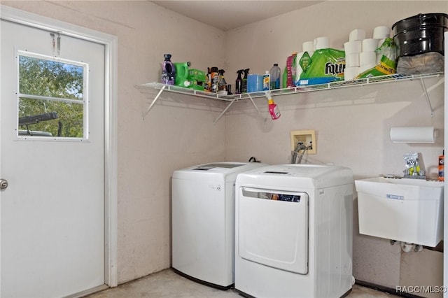 laundry room with sink and washer and clothes dryer