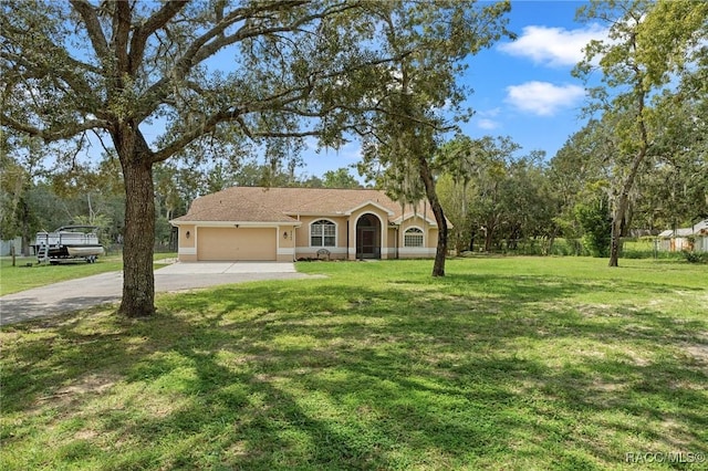 view of front of home with a garage and a front lawn