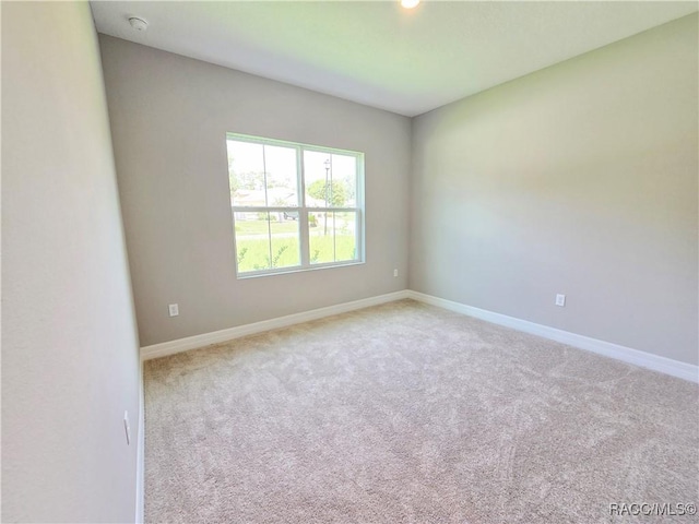 8 Calendula Ct, Homosassa, FL 34446 - spare room featuring carpet, baseboards, a smoke detector, and recessed lighting
