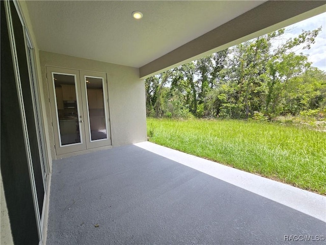 8 Calendula Ct, Homosassa, FL 34446 - view of patio / terrace featuring french doors