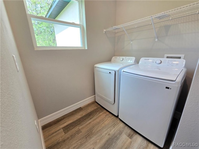 8 Calendula Ct, Homosassa, FL 34446 - washroom featuring washer and dryer, wood finished floors, and baseboards