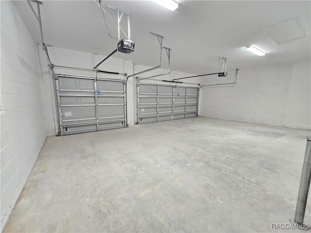 8 Calendula Ct, Homosassa, FL 34446 - garage with a garage door opener and concrete block wall