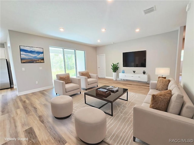 8 Calendula Ct, Homosassa, FL 34446 - living area featuring light wood-style flooring, baseboards, and recessed lighting