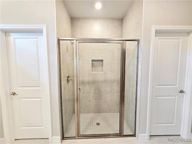 full bathroom featuring a stall shower