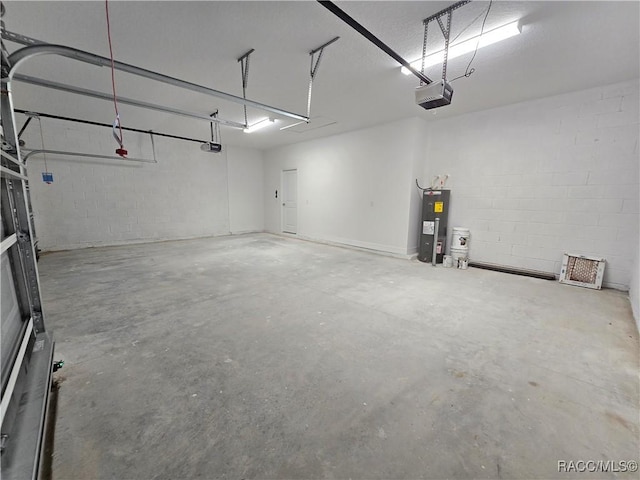 8 Calendula Ct, Homosassa, FL 34446 - garage with a garage door opener, electric water heater, and concrete block wall