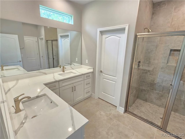 8 Calendula Ct, Homosassa, FL 34446 - full bathroom featuring double vanity, a shower stall, baseboards, and tile patterned flooring