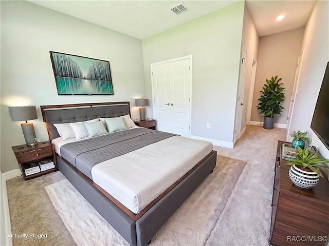 8 Calendula Ct, Homosassa, FL 34446 - bedroom with light carpet, baseboards, and a closet